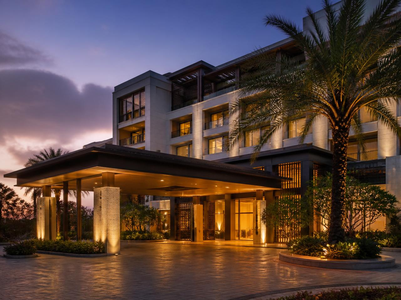 Contemporary hotel entrance and porte cochere at dusk