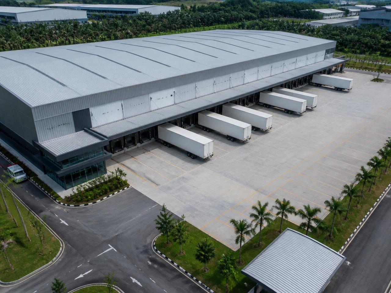 Aerial view of a modern logistics warehouse with loading bays