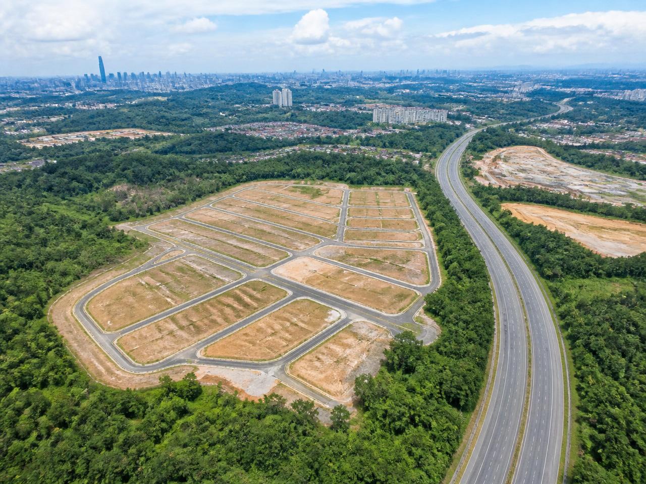 Aerial view of surveyed development land parcels beside a highway