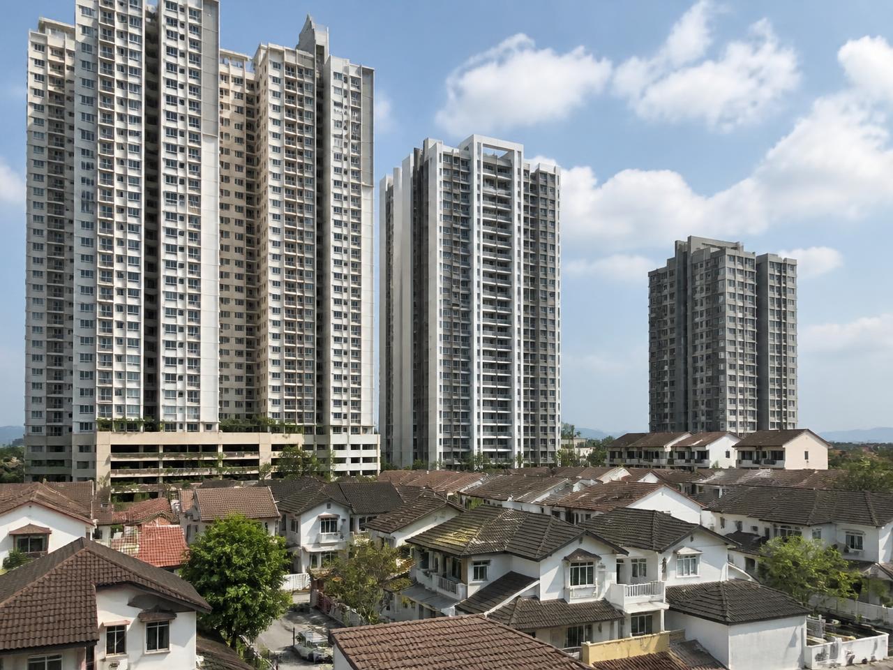 High-rise residential towers beside landed housing in Malaysia